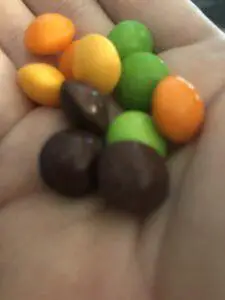Skittles Shriekers Review candies in hand