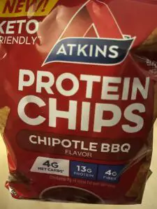 Atkins Chipotle BBQ Protein Chips logo